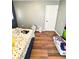 Bedroom with hardwood floors and a floral pattern bedspread at 4144 Richelieu Rd, Indianapolis, IN 46226