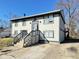 Two-story home featuring neutral siding, dark trim, and a concrete driveway for convenient parking at 4144 Richelieu Rd, Indianapolis, IN 46226