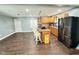 Kitchen featuring oak cabinets, granite countertops, stainless steel appliances, and a center island at 4144 Richelieu Rd, Indianapolis, IN 46226