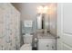 Neutral bathroom with anchor themed shower curtain, granite vanity, and modern fixtures at 4309 Viva Ln, Indianapolis, IN 46239