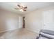 Cozy bedroom with neutral walls, carpet, ceiling fan, and ensuite bathroom at 4309 Viva Ln, Indianapolis, IN 46239