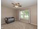Cozy bedroom with large window, neutral walls, carpet, and ceiling fan at 4309 Viva Ln, Indianapolis, IN 46239