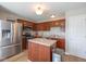 Well-equipped kitchen featuring stainless steel appliances, an island, and ample cabinetry at 4309 Viva Ln, Indianapolis, IN 46239