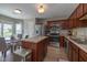 Modern kitchen featuring island, stainless appliances, and view of breakfast nook at 4309 Viva Ln, Indianapolis, IN 46239
