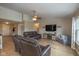 Open living room with entertainment center, view of front door, and backyard view at 4309 Viva Ln, Indianapolis, IN 46239
