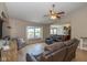 Spacious living room with lots of sunlight, ceiling fan, and view of open kitchen at 4309 Viva Ln, Indianapolis, IN 46239