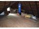 View of attic space with wood flooring and exposed rafters at 4718 W Troy Ave, Indianapolis, IN 46241
