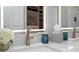 Close-up of bathroom featuring a double vanity, lighted mirrors, and modern accents at 5047 Skipping Stone Dr, Indianapolis, IN 46237