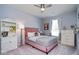 Cozy bedroom featuring a pink bed, a window, and soft natural light at 5047 Skipping Stone Dr, Indianapolis, IN 46237