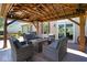 A covered patio area featuring comfortable seating, perfect for outdoor relaxation and entertainment at 5047 Skipping Stone Dr, Indianapolis, IN 46237
