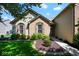 Charming home featuring a well-manicured front yard with lush green grass and mature landscaping at 5047 Skipping Stone Dr, Indianapolis, IN 46237