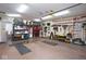 Spacious two-car garage with ample shelving and storage systems for tools, equipment, and organizational needs at 5047 Skipping Stone Dr, Indianapolis, IN 46237