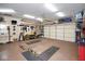 Spacious two car garage is well-equipped with tools and storage, perfect for hobbyists and organization at 5047 Skipping Stone Dr, Indianapolis, IN 46237