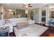 Spacious living room with a large comfy couch and hardwood floors open to the kitchen at 5047 Skipping Stone Dr, Indianapolis, IN 46237