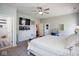 Large bedroom with a TV, ceiling fan, and an en-suite bathroom at 5047 Skipping Stone Dr, Indianapolis, IN 46237
