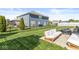 Spacious, fenced backyard featuring lush lawn, patio furniture, and ample room for outdoor activities at 5622 Hare Dr, Noblesville, IN 46062