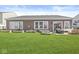 Expansive backyard featuring a well-maintained lawn and raised garden beds, great for entertaining at 5622 Hare Dr, Noblesville, IN 46062
