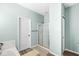 Bathroom featuring tiled shower, door to hall, and tiled floors at 5622 Hare Dr, Noblesville, IN 46062