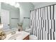 Bathroom with vanity, mirror, and decorative shower curtain at 5622 Hare Dr, Noblesville, IN 46062