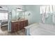 Bathroom with double sink vanity, bathtub, and tile flooring at 5622 Hare Dr, Noblesville, IN 46062