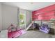 bedroom with vibrant pink wall and bunk bed at 5622 Hare Dr, Noblesville, IN 46062
