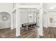 Spacious dining room featuring modern lighting, hardwood floors, and comfortable seating for guests at 5622 Hare Dr, Noblesville, IN 46062