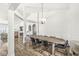 Elegant dining room with hardwood floors, stylish chandelier, and ample seating for gatherings at 5622 Hare Dr, Noblesville, IN 46062