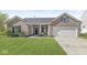Charming brick home featuring a well-manicured lawn and an attached two-car garage at 5622 Hare Dr, Noblesville, IN 46062