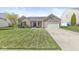 Charming brick home with manicured lawn and attached garage at 5622 Hare Dr, Noblesville, IN 46062