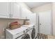 Laundry room featuring washer, dryer, and storage at 5622 Hare Dr, Noblesville, IN 46062