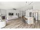 Spacious open-concept living area with modern decor, a cozy fireplace, and seamless flow to the dining and kitchen areas at 5622 Hare Dr, Noblesville, IN 46062