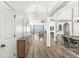 Bright and airy living space with hardwood floors, modern lighting, and an open floor plan at 5622 Hare Dr, Noblesville, IN 46062
