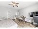 Bright primary bedroom featuring a crib, workspace, and neutral decor, creating a comfortable and functional living space at 5622 Hare Dr, Noblesville, IN 46062