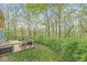 Lovely back deck area with outdoor furniture, a grill, and views of nature at 5948 Ridge Hill Way, Avon, IN 46123