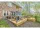Large back deck area with outdoor furniture, a grill, and fire pit at 5948 Ridge Hill Way, Avon, IN 46123