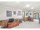 Finished basement with wood paneling, neutral carpet, and access to a bathroom and outdoors at 5948 Ridge Hill Way, Avon, IN 46123