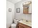 Small bathroom with white tiled walls, a vanity, and standard fixtures at 5948 Ridge Hill Way, Avon, IN 46123