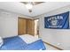 Bedroom with neutral carpet and fun Butler University decor at 5948 Ridge Hill Way, Avon, IN 46123