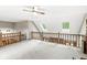 Open bonus room with ceiling fan, skylights, and railing overlooking lower level living area at 5948 Ridge Hill Way, Avon, IN 46123