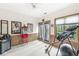 Bonus room with wood paneling, a ceiling fan, and access to the backyard at 5948 Ridge Hill Way, Avon, IN 46123