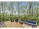 Relaxing wooden deck area with outdoor seating and peaceful wooded views at 5948 Ridge Hill Way, Avon, IN 46123