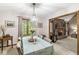 Inviting dining room featuring a brick fireplace and large window view of the outdoors at 5948 Ridge Hill Way, Avon, IN 46123