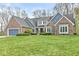 Charming brick home with a well-manicured lawn and attached two-car garage at 5948 Ridge Hill Way, Avon, IN 46123