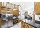 Spacious kitchen with modern stainless steel appliances and open layout to the dining area at 5948 Ridge Hill Way, Avon, IN 46123