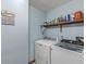 Functional laundry room with modern appliances and ample storage space on the shelf at 5948 Ridge Hill Way, Avon, IN 46123
