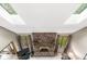 Bright living room with skylights, brick fireplace, and large windows with backyard views at 5948 Ridge Hill Way, Avon, IN 46123