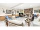 Finished basement with brick fireplace, exercise equipment, and casual seating area at 5948 Ridge Hill Way, Avon, IN 46123