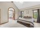 Bright main bedroom with vaulted ceilings, neutral paint, and access to ensuite bathroom with glass door at 5948 Ridge Hill Way, Avon, IN 46123