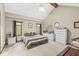 Bright main bedroom with vaulted ceilings, neutral paint, ceiling fan, and a large bed and dresser at 5948 Ridge Hill Way, Avon, IN 46123