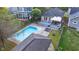 Aerial view of the backyard featuring a sparkling swimming pool and a deck for entertaining at 6167 Carrollton Ave, Indianapolis, IN 46220